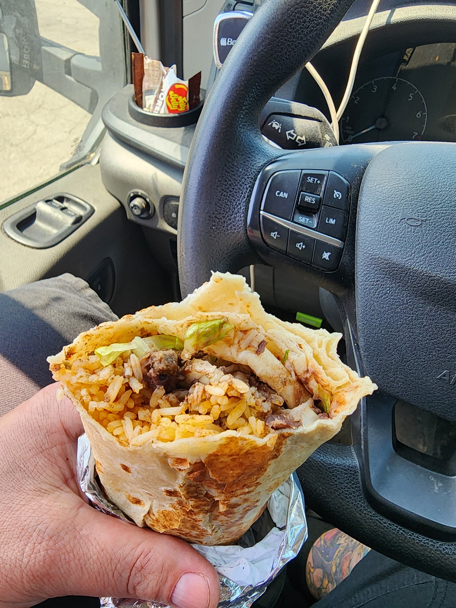 Burrito Supreme in hand