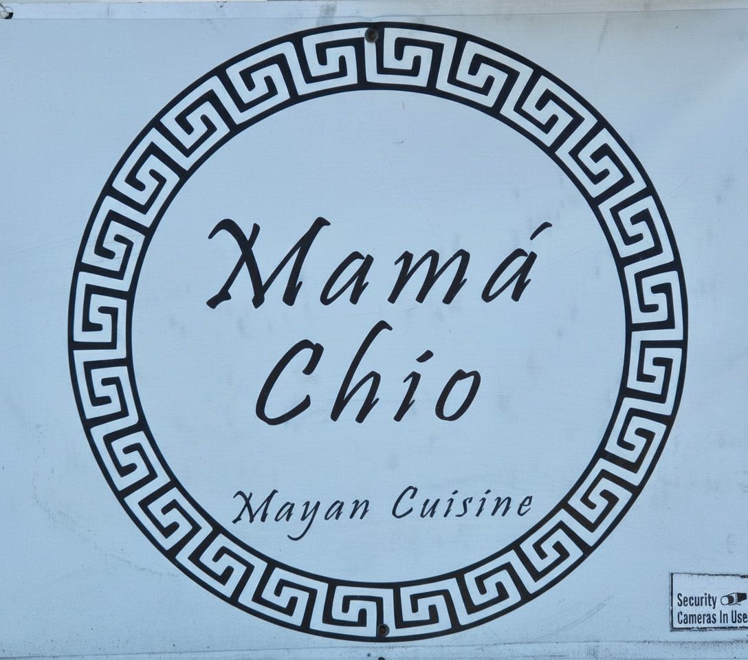 Mamá Chio Mayan Cuisine — hand-painted circle sign